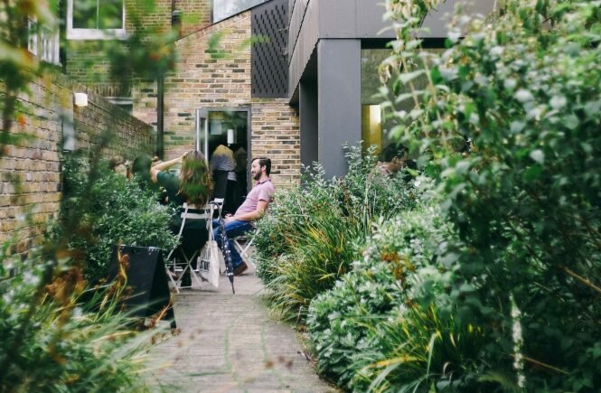 manand woman sitting in garden to highlight this article is about disabled aids for home and garden