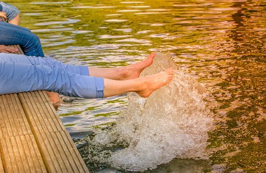 legs dangling in water to highlight restless leg syndrome